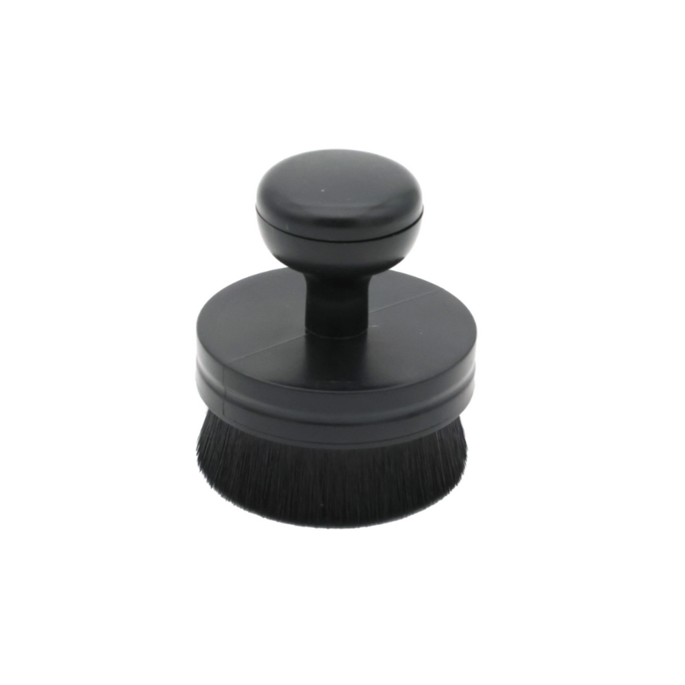 Black round Tire & Trim Applicator Brush with soft bristles and ergonomic handle for easy grip and application.