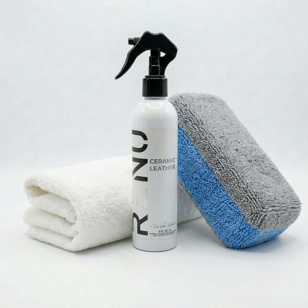 Ceramic Leather spray bottle with two microfiber towels, one white and one gray with blue edge, on white background