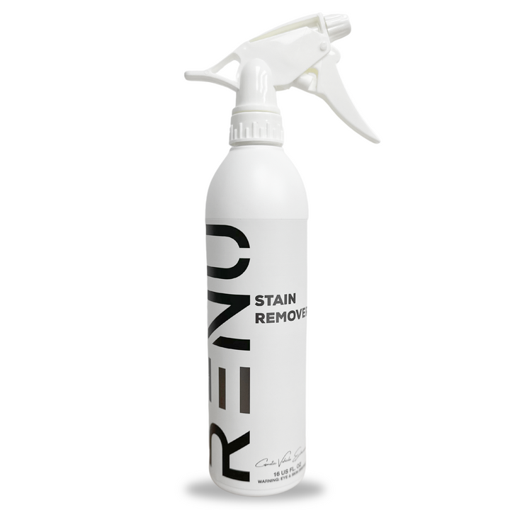 White spray bottle labeled Stain Remover with a trigger nozzle for easy application