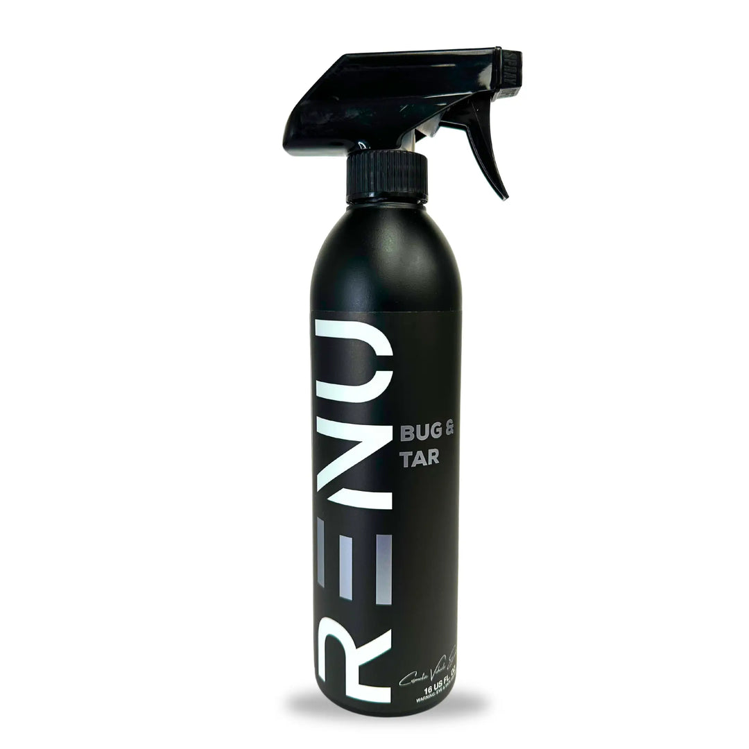 Black spray bottle labeled Bug + Tar with nozzle for cleaning or removing substances from surfaces