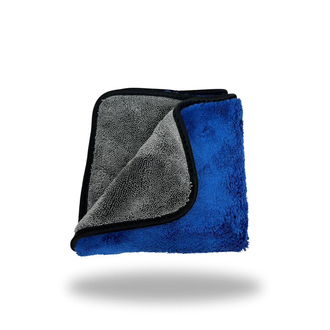 Dual-Faced Twisted Loop & Fleece Polishing Towel folded to show blue fleece on one side and gray twisted loop microfiber on the other.