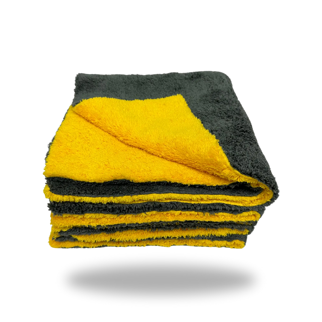 Folded yellow and gray soft cleaning cloth made of Edgeless Dual-Faced Microfiber material.