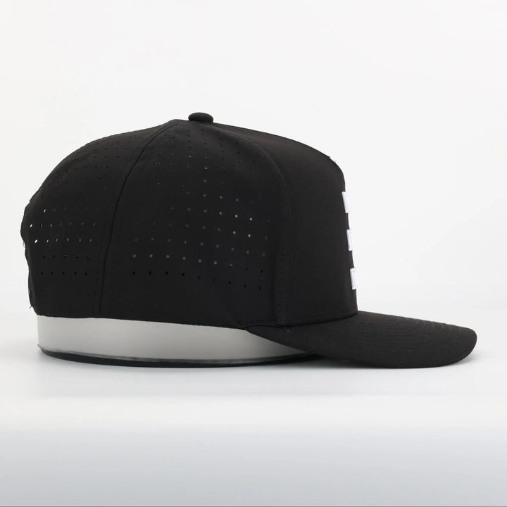 Finish Line Series Hat - Black showing side view with perforated breathable fabric and flat brim design.