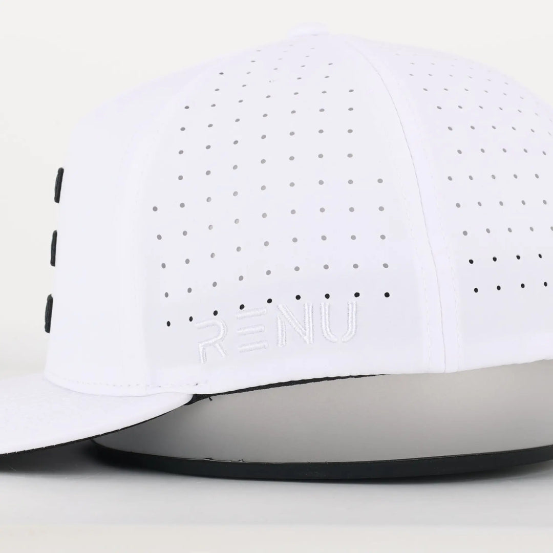 Close-up of a white perforated cap with "RENU" embroidery on the side, labeled Finish Line Series Hat - White.