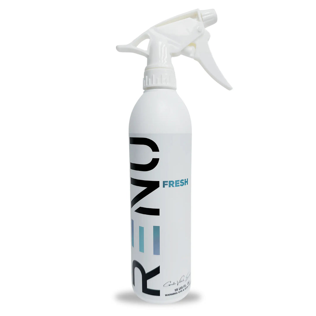 White spray bottle labeled FRESH (Air Freshener + Odor Eliminator) with a trigger nozzle for easy use.