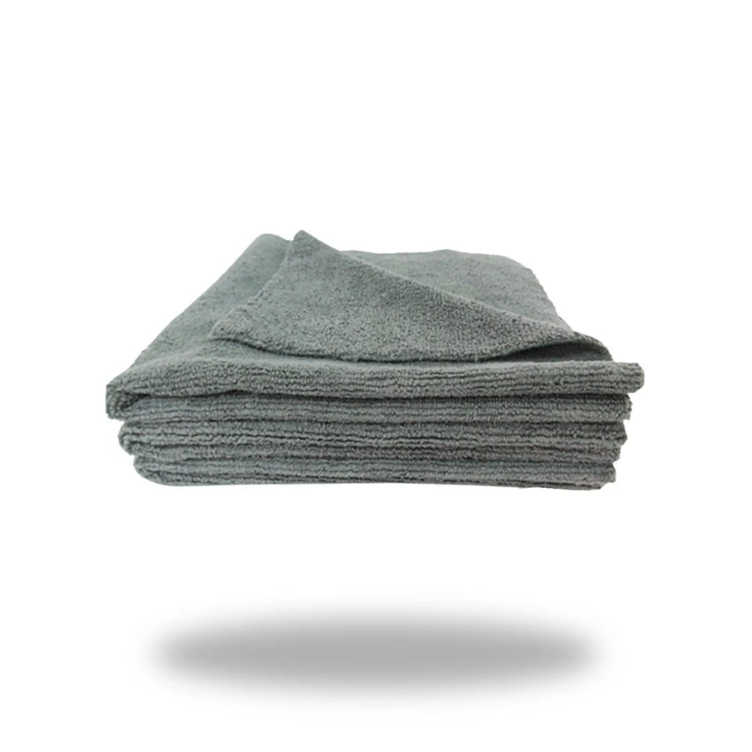 Grey Edgeless 16 towel folded neatly, showcasing soft textured fabric in a solid grey color on white background.
