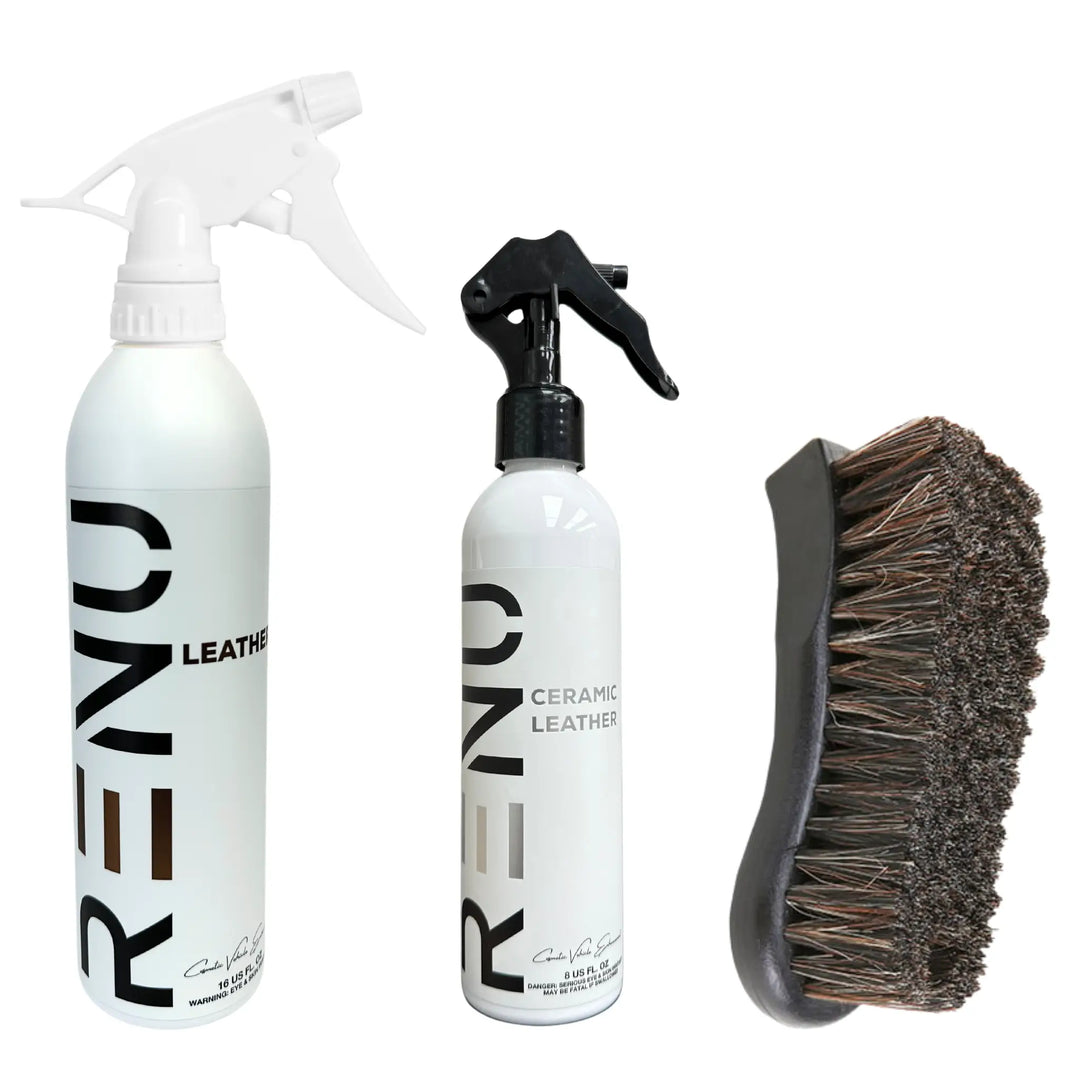 Leather Clean + Protect Kit with two spray bottles and a curved brush for leather care and protection.
