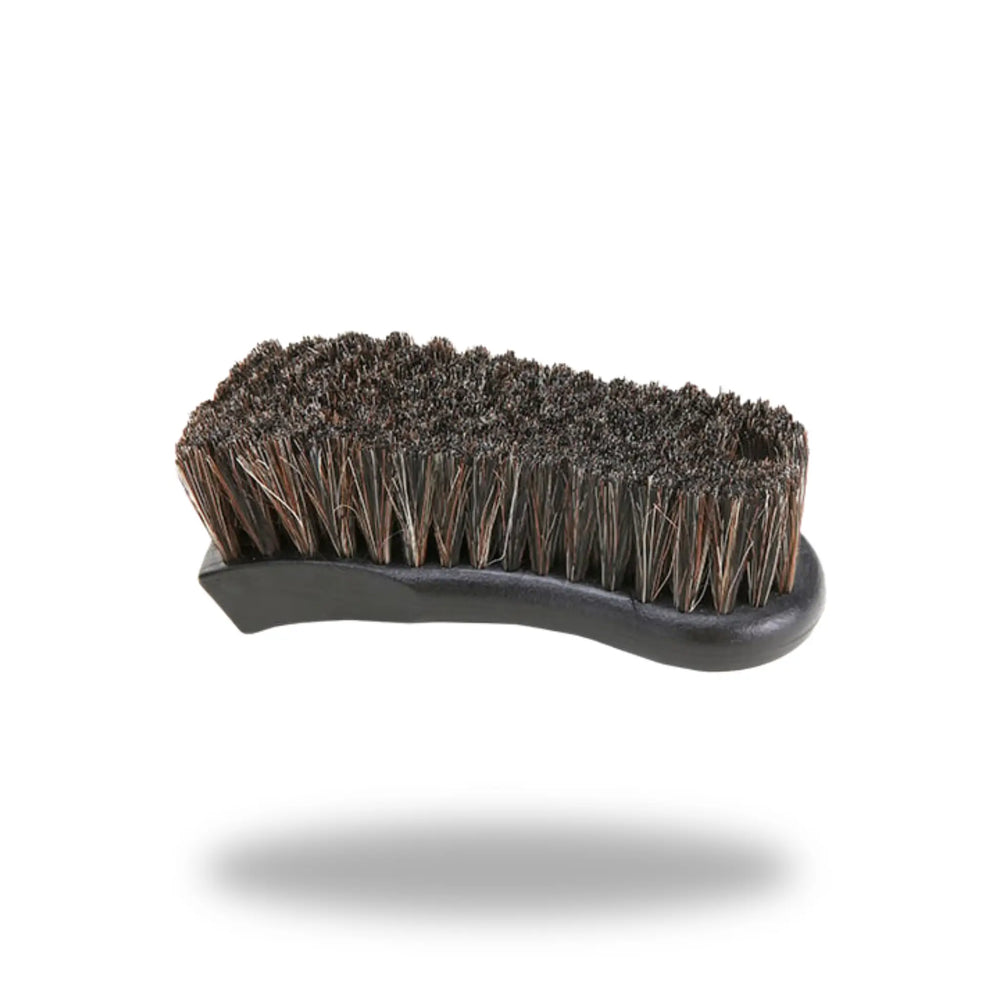 Leather & Upholstery Cleaning Brush with dense bristles and ergonomic black handle for effective cleaning of leather and fabric surfaces