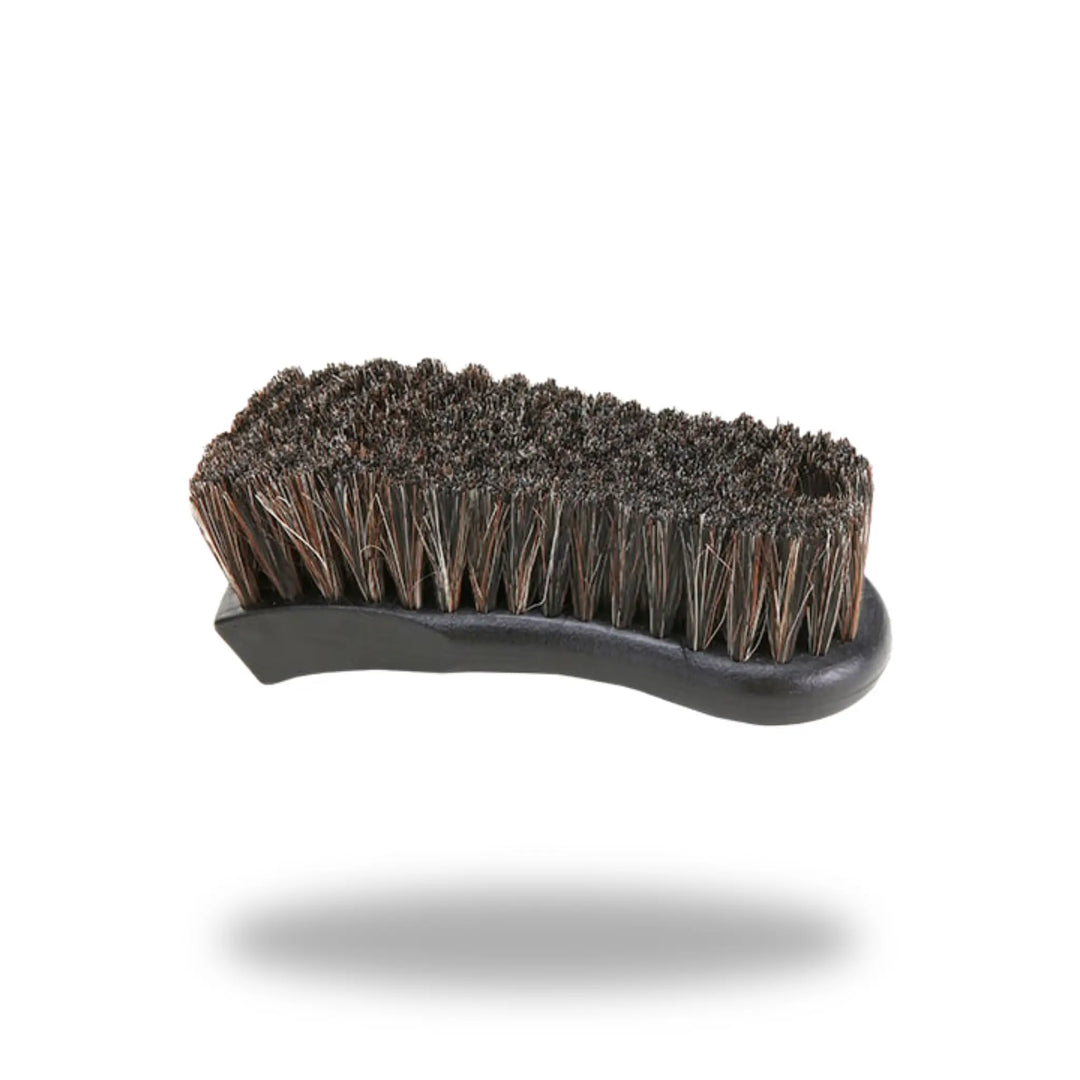 Leather &amp; Upholstery Cleaning Brush with dense bristles and ergonomic black handle for effective cleaning of leather and fabric surfaces
