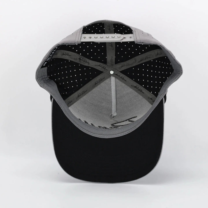 Inside view of a Script Grey cap showing black adjustable strap and inner sweatband with branded tape detailing.