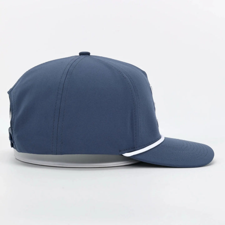 Side view of a Signature Blue snapback cap with a flat brim and white trim detail.
