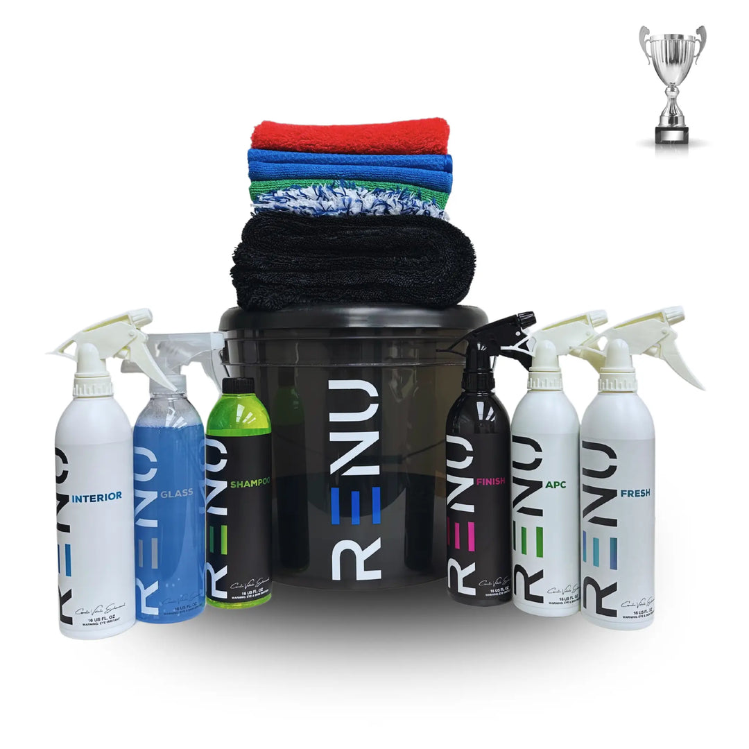 Silver Car Care Kit with multiple cleaning sprays, microfiber towels, and a black bucket for car detailing and maintenance.