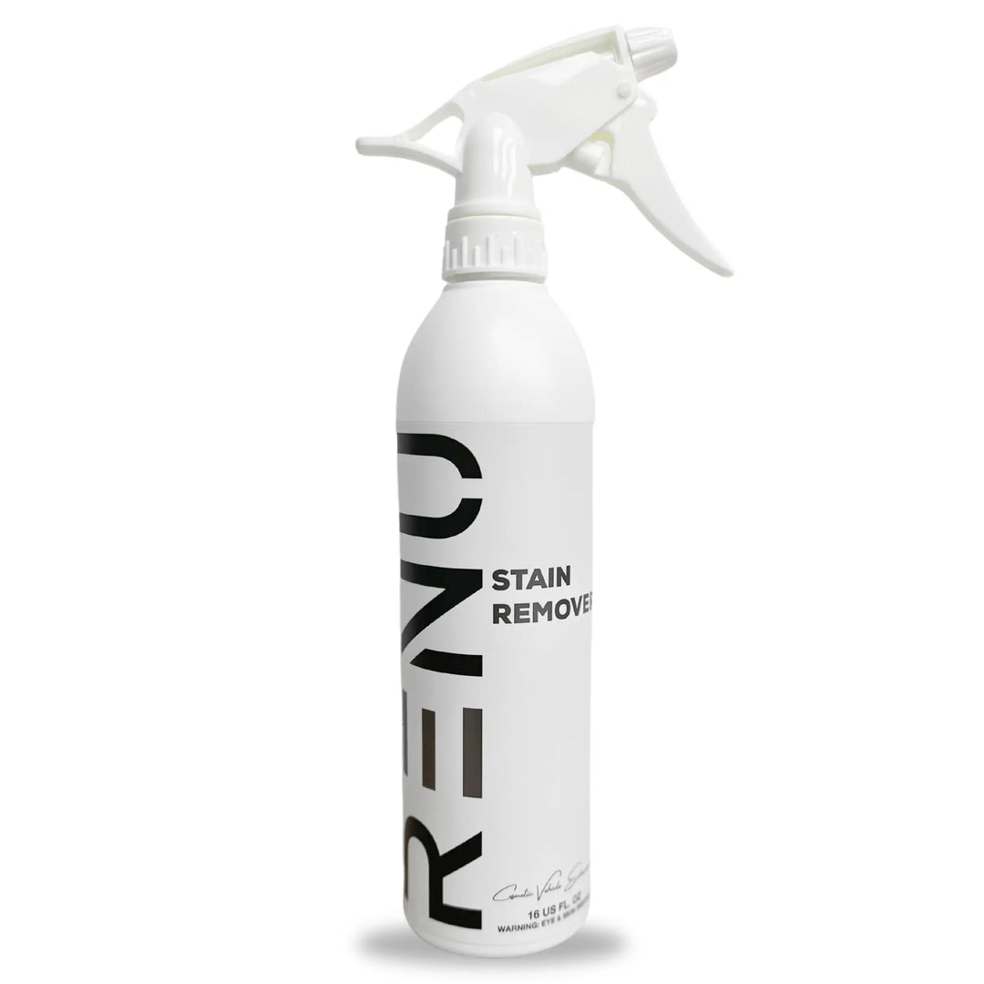 White spray bottle labeled Stain Remover with a trigger nozzle for easy application
