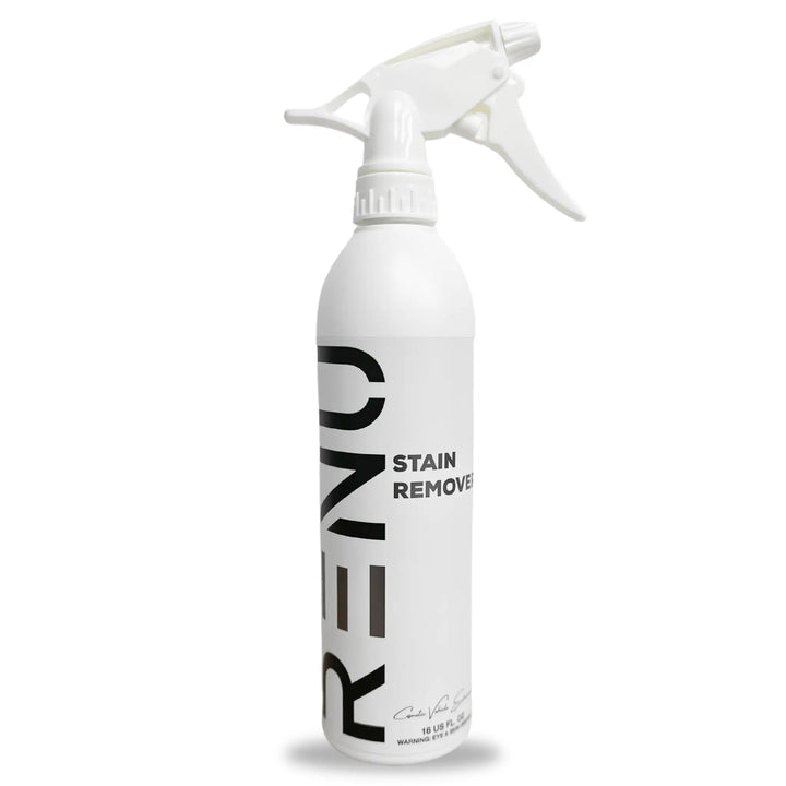 White spray bottle labeled Stain Remover with a trigger nozzle for easy application