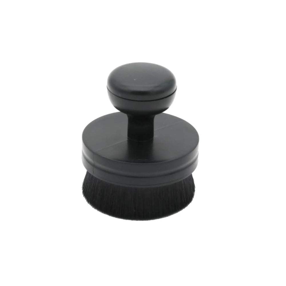 Black round Tire & Trim Applicator Brush with soft bristles and ergonomic handle for easy grip and application.