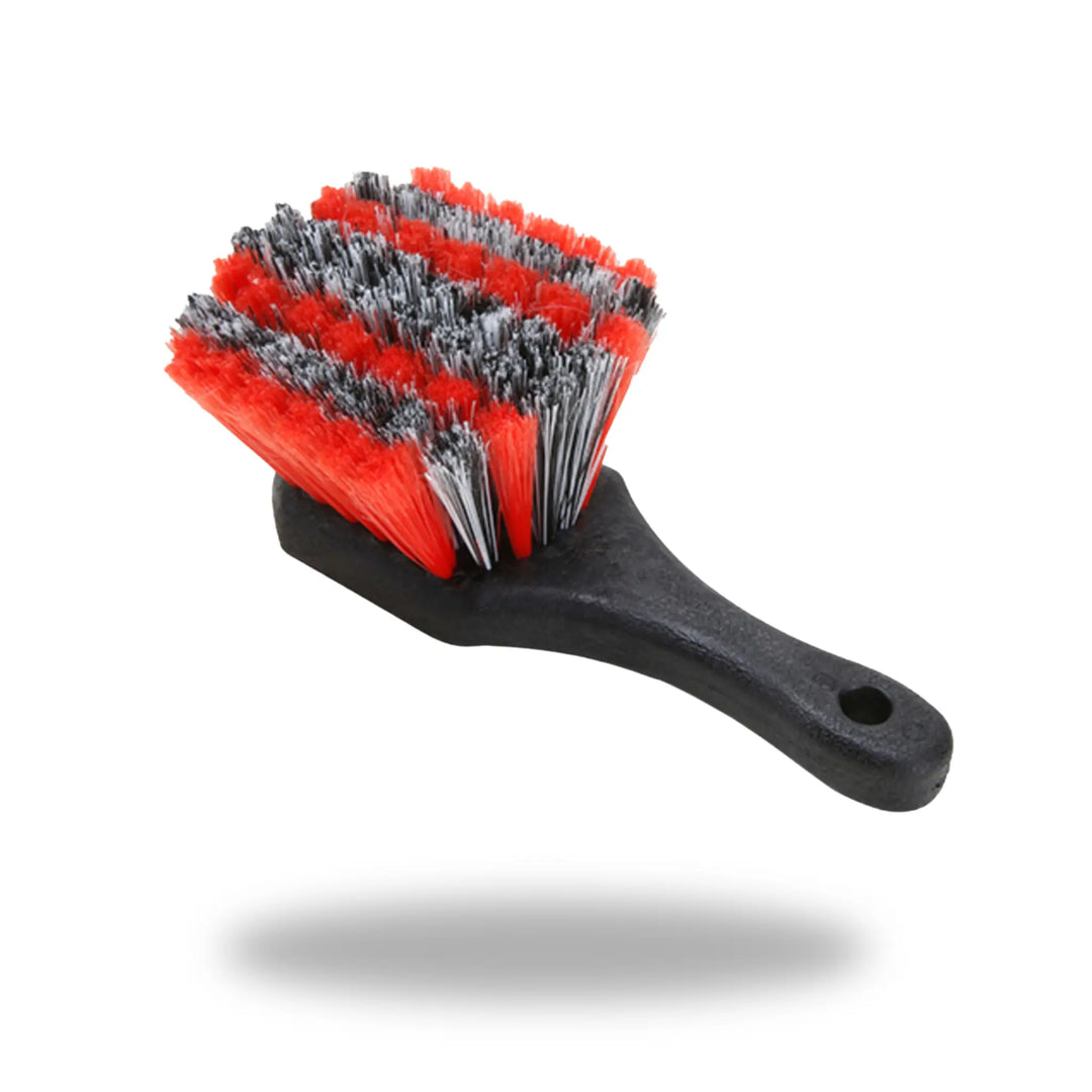 Tire & Wheel Cleaning Brush with black handle and dense red and gray bristles designed for effective cleaning.